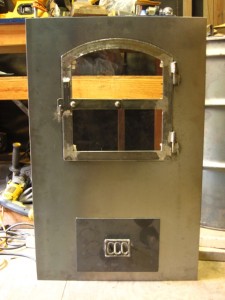 cob cottage masonry heater door